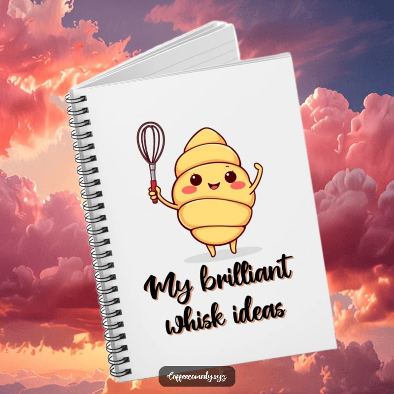 Funny notebook with a smiling croissant character waving a small whisk, perfect for jotting down recipes or daily thoughts.